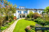 FFamilienfreundliches Einfamilienhaus mit Garten, Kamin und modernisierter Heizungsanlage - KI generiertes Bespielbild Ansicht Gartenseite