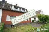 Seltene Gelegenheit: Ein-/Zweifamilienhaus mit großem Grundstück in zentraler Lage von Lövenich - Titelbild Außenansicht