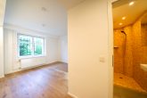 Köln-Marienburg: Moderne 2-Zimmer-Wohnung mit Sonnengarten und Garage in exklusiver Lage - Schlafzimmer mit Bad en Suite