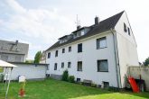 6-Familienhaus mit Baugrundstück und 6 Garagen in Ruhiglage von Bergisch Gladbach Schildgen - Rückansicht
