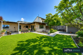 Bungalow mit 130 m² Wohnfläche + 40 m² wohnlicher Nutzfläche und Süd-Garten in Bergheim-Kenten - Rückansicht