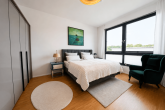 Exklusive Penthousewohnung mit Süd-Dachterrasse & Tiefgaragenstellplatz in Köln-Junkersdorf - klimatiesiertes Schlafzimmer