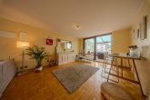 Charmantes Familiendomizil in Bestlage von Rondorf: 109m² Wfl. + 21m² Wintergarten mit Kaminofen - Wohnzimmer